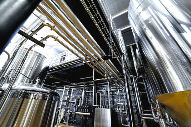 istock Pipes and fittings at a craft modern brewery 1326923780