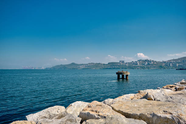 Concrete structure and building in Gemlik Port in Bursa during sunny and shiny day. Sea and city background