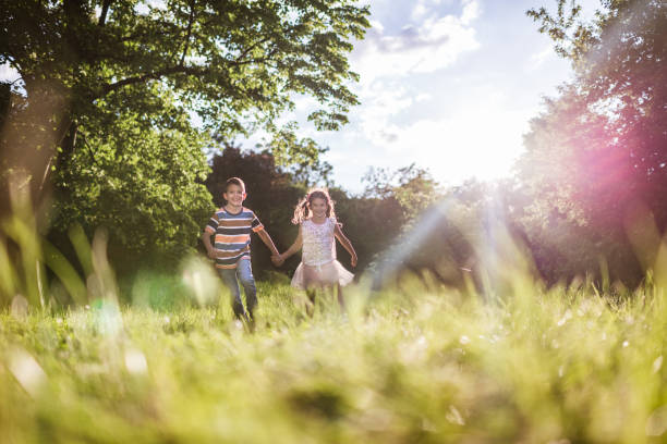 istock Beautiful children running in nature 1326924882