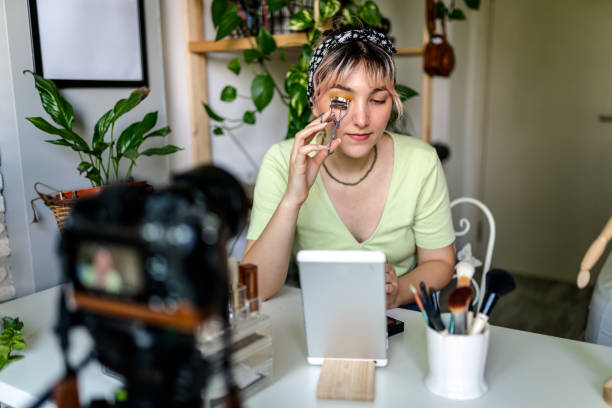 istock Young Woman vlogging about makeup at home 1326925740