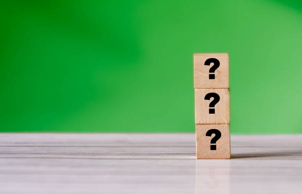 istock Quiz concept symbol with question mark on wooden cube blocks. Support or questionnaire background pattern 1326925770