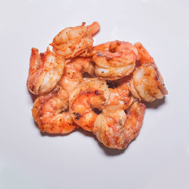 istock Shrimp Scampi isolated on a white background 1326926530