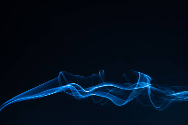 istock Blue smoke isolated on black background. 1326927724