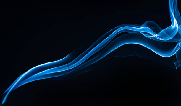 istock Blue smoke isolated on black background. 1326927728