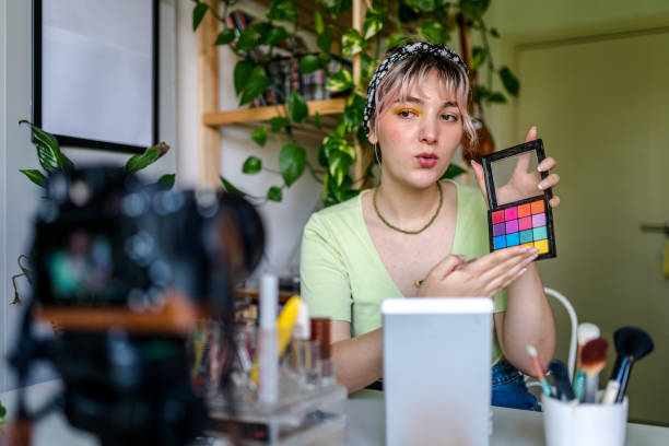 istock Young Woman vlogging about makeup at home 1326928559