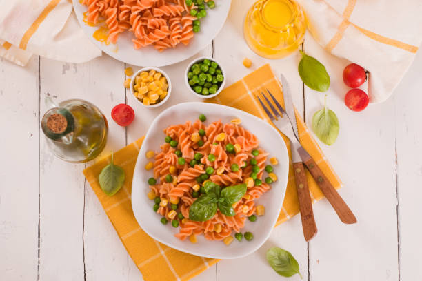 istock Fusilli pasta with peas and sweet corn. 1326929884