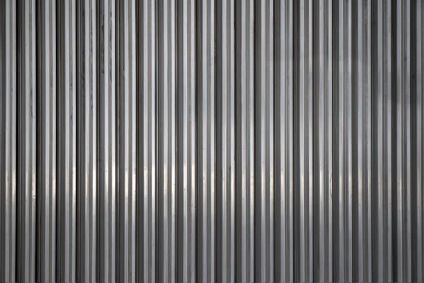 istock Background from unpainted corrugated metal. Vertical stripes. 1326929892