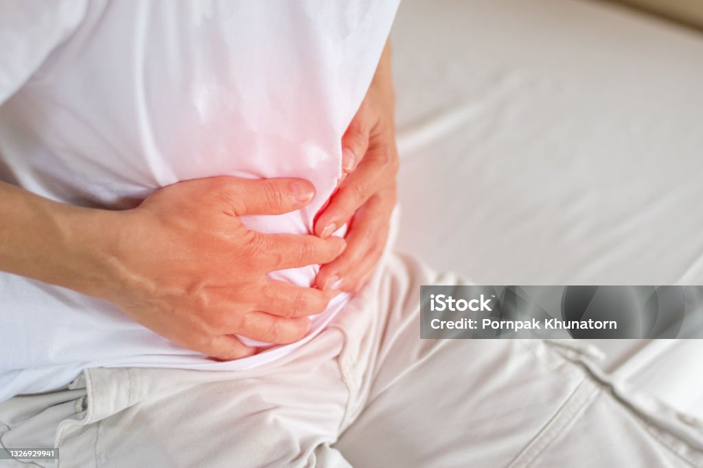 Stomachache symptom of irritable bowel syndrome, Chronic Diarrhea, Colon, stomach pain,Crohnâs Disease, Gastroesophageal Reflux Disease (GERD), gallstone,gastric pain. Stomachache Stock Photo