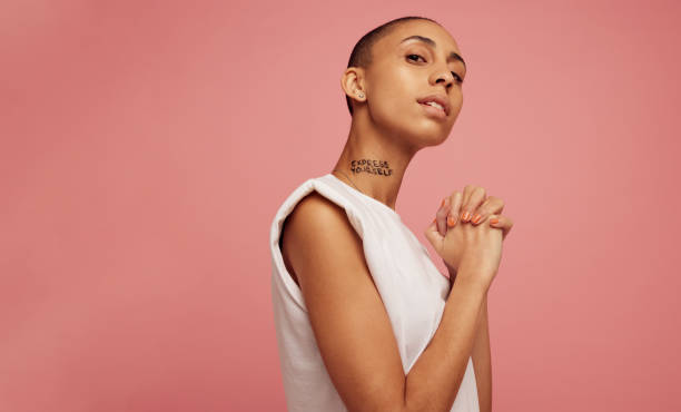 istock Confident woman with express yourself written on her neck. 1326931007
