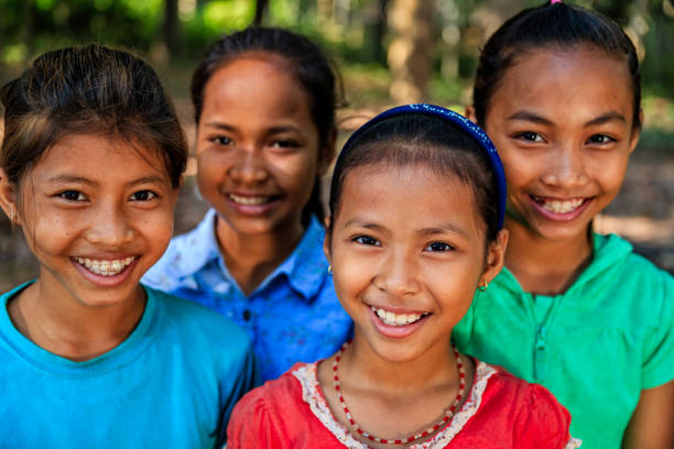 Group of Cambodian children in village near Siem Reap, Cambodia Group of happy Cambodian children in village near Siem Reap, Cambodia cambodian ethnicity stock pictures, royalty-free photos & images
