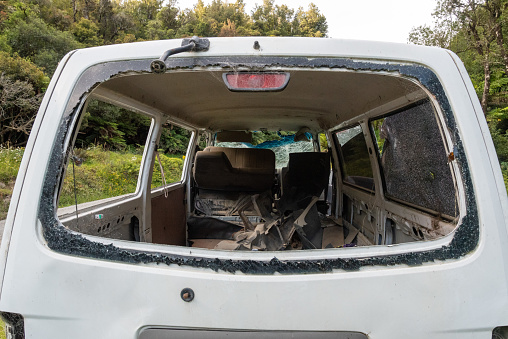 Destructed car after an accident on the road in Te Urewera National Park, New Zealand
