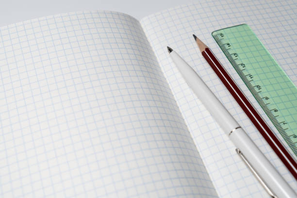 istock Open notebook with pen, pencil, and ruler. School accessories. 1326941928