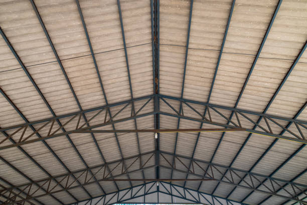istock Steel roof structure. Moonlight bulb. Steel structure with roof tiles. Architectural structure of roof. Large roof layout used for industrial plants. 1326942093