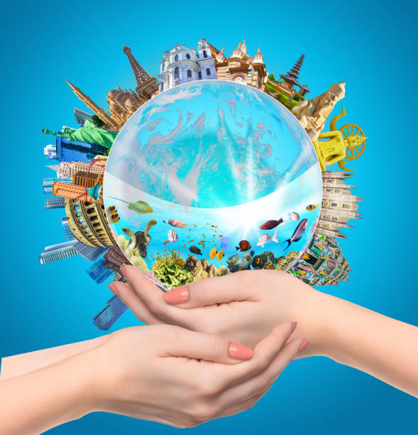 istock Woman holding globe on her hands, 1326944655