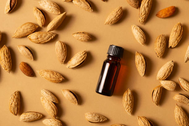 istock Essential almond oil bottles nuts almonds with shell 1326945276
