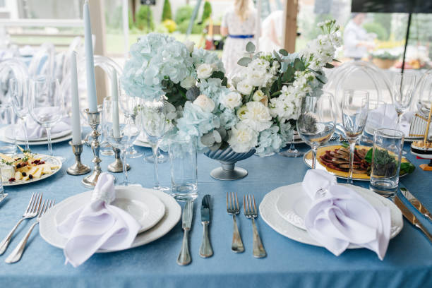 istock Beautiful table setting for an event on a terrace. Empty plates with napkins 1326946432