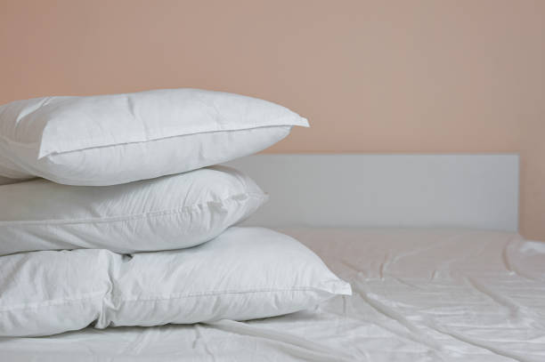 istock neat stack of bedding pillows and a duvet lie on the bed 1326948369