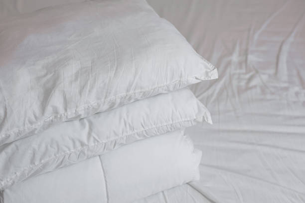 istock neat stack of bedding pillows and a duvet lie on the bed 1326948772