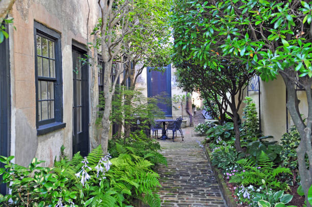 istock Brick Sidewalk with flowers and trees-Charleston, SC 1326951896