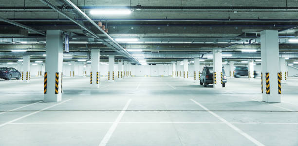 istock Horizontal image of clean white underground parking lot 1326953780