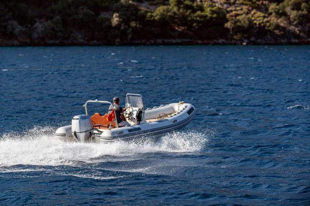 An inflatable boat on the super clean and clear Aegean sea