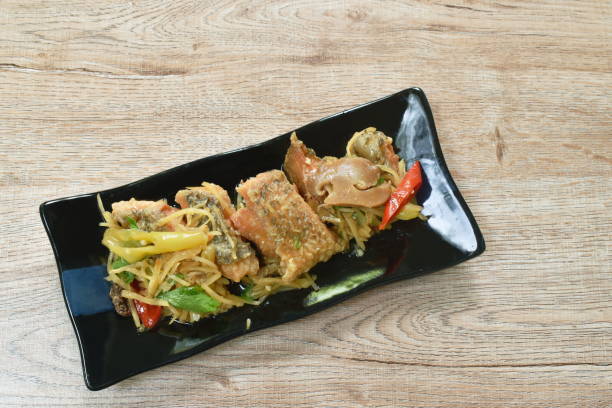 istock deep fried slice striped snake head fish with ginger and celery 1326954226