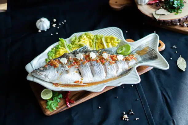 Steamed Seabass with Spicy Chili and Lemon Sauce - Asian food style