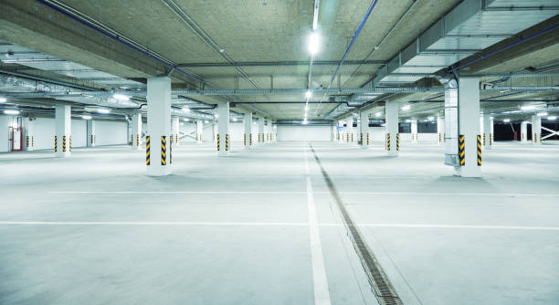 istock Horizontal image of clean white underground parking lot 1326955250