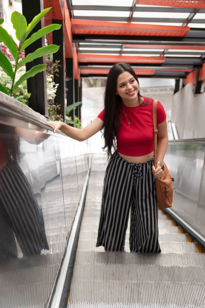 istock latin girl on the escalators 1326957739
