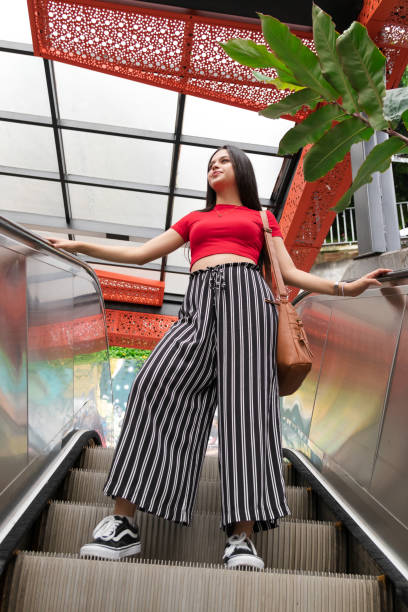 istock latin girl on the escalators 1326957878