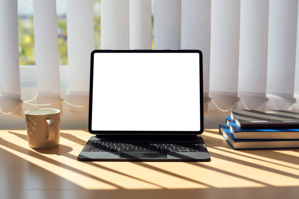 istock Digital tablet blank white screen on the desk. Mock up. 1326961121