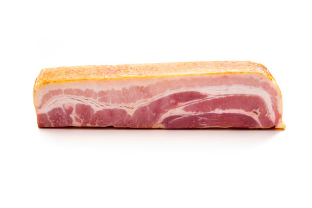 Bacon pork meat piece raw isolated on white background with shadows