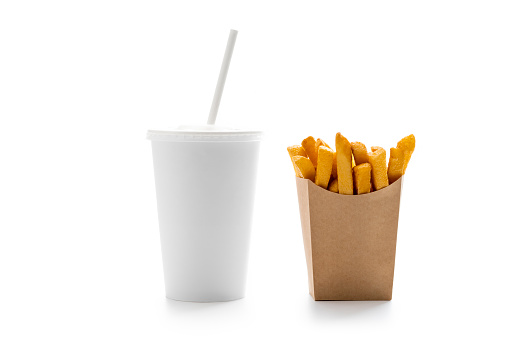 Take away beverage glass with white straw and disposable french fries in kraft paper box  isolated on white background