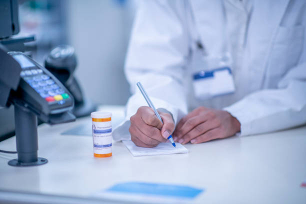 istock Pharmacist writing a prescription for a patient 1326968598