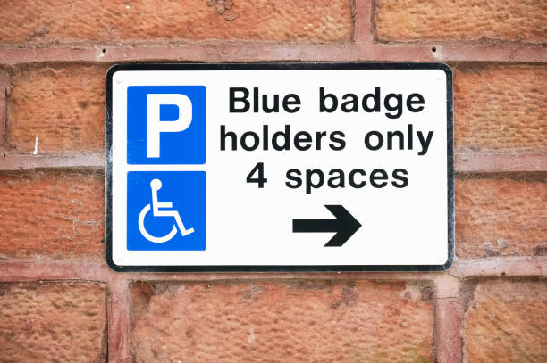 istock Disabled blue badge holder parking sign for driver 1326970959