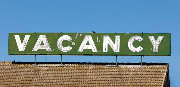 Hotel or motel retro antique dilapidated vacancy sign.