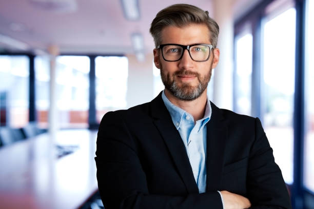 istock Executive businessman standing at the office 1326973467