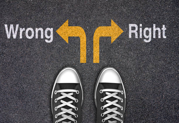 Wrong or Right arrows written on the road Wrong or Right arrows written on the road morality stock pictures, royalty-free photos & images