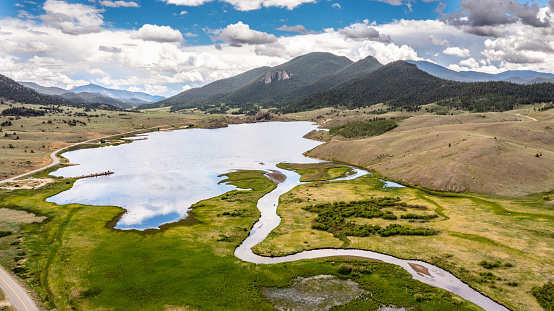 Aerial view of Tarryall Reservoir with mountains and blue sky background, Pike National Forest, Colorado, USA