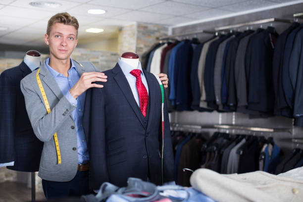 istock man seller measuring business style jacket 1326974592