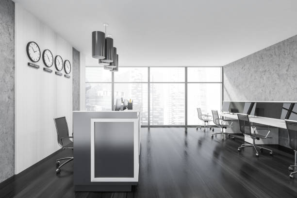 istock Reception room interior desk with furniture, computers, clocks and window 1326980233