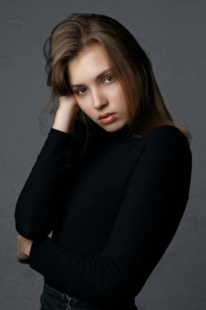 istock Test shooting for wonderful young model with natural makeup wearing black sweater 1326981452