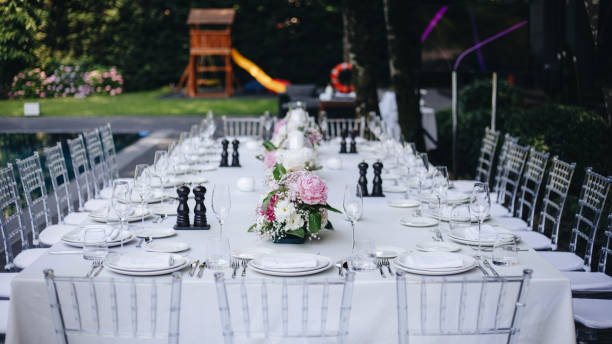 istock tableware Glasses, flower fork, knife served for dinner in restaurant with cozy interior 1326981820