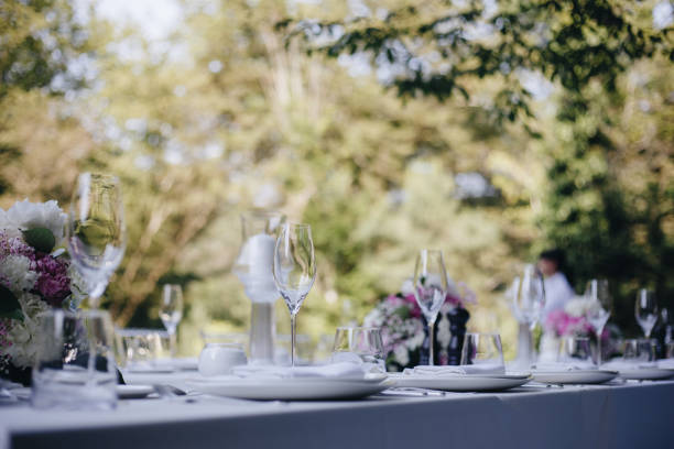 istock tableware Glasses, flower fork, knife served for dinner in restaurant with cozy interior 1326982482