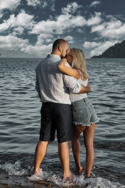 istock Loving couple enjoying honeymoon on territory beach hotel 1326987623