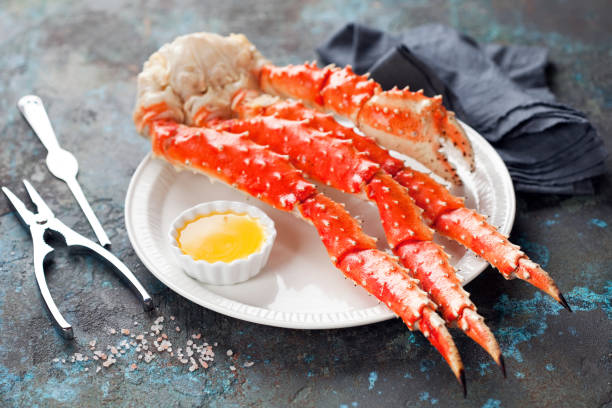 istock Red king crab legs with butter sauce on a plate 1326988303