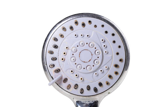 istock Old dirty shower head. Strong dirt in the home bathroom. Light background. 1326988604