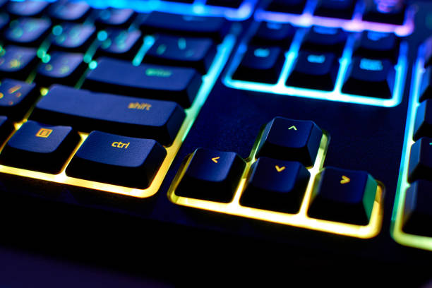 istock Keyboard with RGB light. Backlit keyboard, close-up. Colorful gaming devices 1326989258
