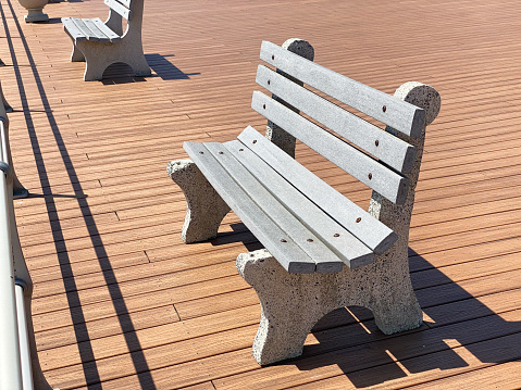 Benches on boardwalk on a sunny day