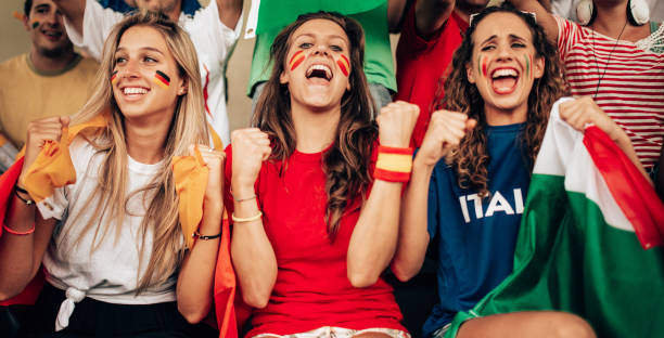 istock italian and spanish supporter at the stadium 1326995892